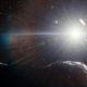 Una ilustración de un asteroide pasando frente al Sol.